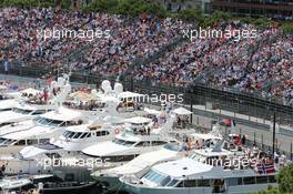 Boats in the scenic Monaco Harbour passed by Daniil Kvyat (RUS) Red Bull Racing RB11. 24.05.2015. Formula 1 World Championship, Rd 6, Monaco Grand Prix, Monte Carlo, Monaco, Race Day.