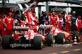 Kimi Raikkonen (FIN) Ferrari SF15-T ans Sebastian Vettel (GER) Ferrari SF15-T in the pits. 21.05.2015. Formula 1 World Championship, Rd 6, Monaco Grand Prix, Monte Carlo, Monaco, Practice Day.