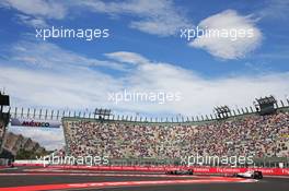 Fernando Alonso (ESP) McLaren MP4-30 leads Valtteri Bottas (FIN) Williams FW37. 30.10.2015. Formula 1 World Championship, Rd 17, Mexican Grand Prix, Mexixo City, Mexico, Practice Day.