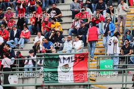 Fans in the grandstand and a Mexican flag. 30.10.2015. Formula 1 World Championship, Rd 17, Mexican Grand Prix, Mexixo City, Mexico, Practice Day.