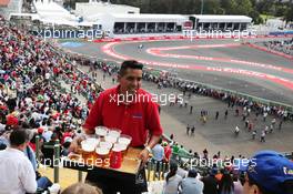 Fans in the grandstand served lager. 30.10.2015. Formula 1 World Championship, Rd 17, Mexican Grand Prix, Mexixo City, Mexico, Practice Day.