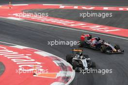 Sergio Perez (MEX) Sahara Force India F1 VJM08 and Max Verstappen (NLD) Scuderia Toro Rosso STR10 at the end of the race. 01.11.2015. Formula 1 World Championship, Rd 17, Mexican Grand Prix, Mexixo City, Mexico, Race Day.