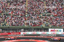 Alexander Rossi (USA) Manor Marussia F1 Team leads team mate Will Stevens (GBR) Manor Marussia F1 Team. 01.11.2015. Formula 1 World Championship, Rd 17, Mexican Grand Prix, Mexixo City, Mexico, Race Day.