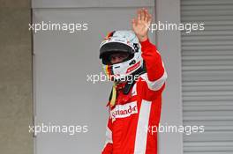 Sebastian Vettel (GER) Ferrari celebrates his third position in qualifying parc ferme. 31.10.2015. Formula 1 World Championship, Rd 17, Mexican Grand Prix, Mexixo City, Mexico, Qualifying Day.
