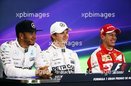 The post qualifying FIA Press Conference (L to R): Lewis Hamilton (GBR) Mercedes AMG F1, second; Nico Rosberg (GER) Mercedes AMG F1, pole position; Sebastian Vettel (GER) Ferrari, third. 31.10.2015. Formula 1 World Championship, Rd 17, Mexican Grand Prix, Mexixo City, Mexico, Qualifying Day.