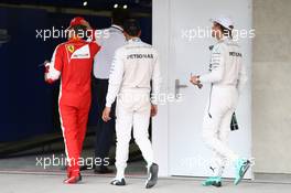 Sebastian Vettel (GER) Ferrari SF15-T with Lewis Hamilton (GBR) Mercedes AMG F1 W06 and Nico Rosberg (GER) Mercedes AMG F1 W06. 31.10.2015. Formula 1 World Championship, Rd 17, Mexican Grand Prix, Mexixo City, Mexico, Qualifying Day.