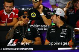 (L to R): Lewis Hamilton (GBR) Mercedes AMG F1 with Sergio Perez (MEX) Sahara Force India F1 in the FIA Press Conference. 29.10.2015. Formula 1 World Championship, Rd 17, Mexican Grand Prix, Mexixo City, Mexico, Preparation Day.