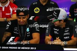 (L to R): Lewis Hamilton (GBR) Mercedes AMG F1 with Sergio Perez (MEX) Sahara Force India F1 in the FIA Press Conference. 29.10.2015. Formula 1 World Championship, Rd 17, Mexican Grand Prix, Mexixo City, Mexico, Preparation Day.
