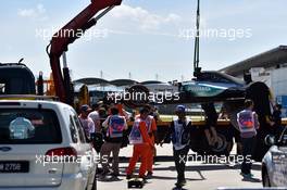 The Mercedes AMG F1 W06 of Lewis Hamilton (GBR) Mercedes AMG F1 is recovered back to the pits on the back of a truck in the first practice session. 27.03.2015. Formula 1 World Championship, Rd 2, Malaysian Grand Prix, Sepang, Malaysia, Friday.