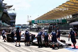 Valtteri Bottas (FIN) Williams FW37 and Felipe Massa (BRA) Williams FW37 in the pits. 27.03.2015. Formula 1 World Championship, Rd 2, Malaysian Grand Prix, Sepang, Malaysia, Friday.