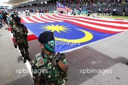 The Malaysian flag on the grid. 29.03.2015. Formula 1 World Championship, Rd 2, Malaysian Grand Prix, Sepang, Malaysia, Sunday.