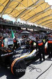 Sergio Perez (MEX) Sahara Force India F1 VJM08 on the grid. 29.03.2015. Formula 1 World Championship, Rd 2, Malaysian Grand Prix, Sepang, Malaysia, Sunday.