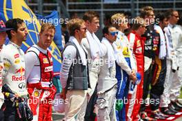 Sebastian Vettel (GER) Ferrari as the grid observes the national anthem. 29.03.2015. Formula 1 World Championship, Rd 2, Malaysian Grand Prix, Sepang, Malaysia, Sunday.