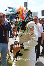 Fernando Alonso (ESP) McLaren on the grid. 29.03.2015. Formula 1 World Championship, Rd 2, Malaysian Grand Prix, Sepang, Malaysia, Sunday.