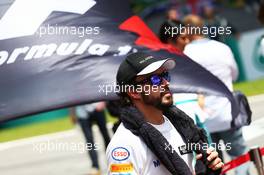 Fernando Alonso (ESP) McLaren as the grid observes the national anthem. 29.03.2015. Formula 1 World Championship, Rd 2, Malaysian Grand Prix, Sepang, Malaysia, Sunday.