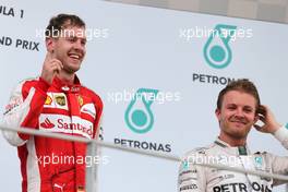 Sebastian Vettel (GER), Scuderia Ferrari and Nico Rosberg (GER), Mercedes AMG F1 Team  29.03.2015. Formula 1 World Championship, Rd 2, Malaysian Grand Prix, Sepang, Malaysia, Sunday.