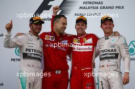1st place Sebastian Vettel (GER) Ferrari 2nd place Lewis Hamilton (GBR) Mercedes AMG F1 and 3rd place Nico Rosberg (GER) Mercedes AMG F1 W06. 29.03.2015. Formula 1 World Championship, Rd 2, Malaysian Grand Prix, Sepang, Malaysia, Sunday.