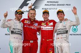 The podium (L to R): Lewis Hamilton (GBR) Mercedes AMG F1, second; Diego Ioverno (ITA) Ferrari Operations Director; Sebastian Vettel (GER) Ferrari, race winner; Nico Rosberg (GER) Mercedes AMG F1, third. 29.03.2015. Formula 1 World Championship, Rd 2, Malaysian Grand Prix, Sepang, Malaysia, Sunday.