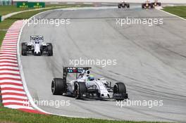 Felipe Massa (BRA) Williams FW37 leads team mate Valtteri Bottas (FIN) Williams FW37. 29.03.2015. Formula 1 World Championship, Rd 2, Malaysian Grand Prix, Sepang, Malaysia, Sunday.