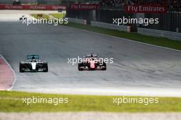 Lewis Hamilton (GBR) Mercedes AMG F1 W06 and Sebastian Vettel (GER) Ferrari SF15-T battle for the lead of the race. 29.03.2015. Formula 1 World Championship, Rd 2, Malaysian Grand Prix, Sepang, Malaysia, Sunday.