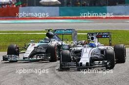 Felipe Massa (BRA) Williams FW37 leads Nico Rosberg (GER) Mercedes AMG F1 W06. 29.03.2015. Formula 1 World Championship, Rd 2, Malaysian Grand Prix, Sepang, Malaysia, Sunday.