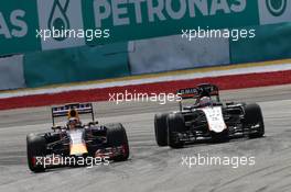 Daniil Kvyat (RUS) Red Bull Racing RB11 and Nico Hulkenberg (GER) Sahara Force India F1 VJM08 battle for position. 29.03.2015. Formula 1 World Championship, Rd 2, Malaysian Grand Prix, Sepang, Malaysia, Sunday.