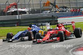 Felipe Nasr (BRA) Sauber C34 and Sebastian Vettel (GER) Ferrari SF15-T. 29.03.2015. Formula 1 World Championship, Rd 2, Malaysian Grand Prix, Sepang, Malaysia, Sunday.