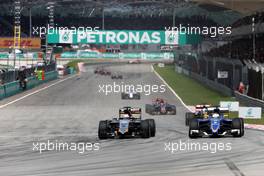 Nico Hulkenberg (GER), Sahara Force India and Marcus Ericsson (SWE), Sauber F1 Team  29.03.2015. Formula 1 World Championship, Rd 2, Malaysian Grand Prix, Sepang, Malaysia, Sunday.