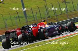 Daniel Ricciardo (AUS) Red Bull Racing RB11 and Max Verstappen (NLD) Scuderia Toro Rosso STR10 bfe. 29.03.2015. Formula 1 World Championship, Rd 2, Malaysian Grand Prix, Sepang, Malaysia, Sunday.