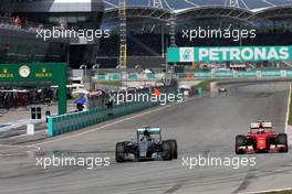 Nico Rosberg (GER), Mercedes AMG F1 Team and Kimi Raikkonen (FIN), Scuderia Ferrari  29.03.2015. Formula 1 World Championship, Rd 2, Malaysian Grand Prix, Sepang, Malaysia, Sunday.