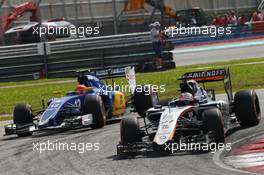 Nico Hulkenberg (GER) Sahara Force India F1 VJM08 leads Felipe Nasr (BRA) Sauber C34. 29.03.2015. Formula 1 World Championship, Rd 2, Malaysian Grand Prix, Sepang, Malaysia, Sunday.