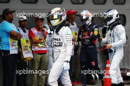 Lewis Hamilton (GBR) Mercedes AMG F1 celebrates his pole position in parc ferme. 28.03.2015. Formula 1 World Championship, Rd 2, Malaysian Grand Prix, Sepang, Malaysia, Saturday.