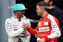 Lewis Hamilton (GBR) Mercedes AMG F1 and Sebastian Vettel (GER) Ferrari SF15-T. 28.03.2015. Formula 1 World Championship, Rd 2, Malaysian Grand Prix, Sepang, Malaysia, Saturday.