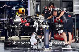 The Red Bull Racing RB11 is prepared in the pit garage. 26.03.2015. Formula 1 World Championship, Rd 2, Malaysian Grand Prix, Sepang, Malaysia, Thursday.