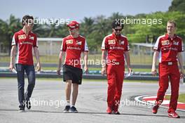 Sebastian Vettel (GER) Ferrari and Esteban Gutierrez (MEX) Ferrari Test and Reserve Driver walk the circuit. 26.03.2015. Formula 1 World Championship, Rd 2, Malaysian Grand Prix, Sepang, Malaysia, Thursday.
