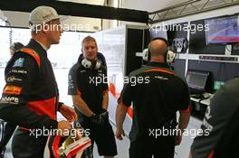 Nico Hulkenberg (GER) Sahara Force India F1 watches the track clear up that delayed the start of FP1. 09.10.2015. Formula 1 World Championship, Rd 15, Russian Grand Prix, Sochi Autodrom, Sochi, Russia, Practice Day.