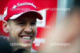 Sebastian Vettel (GER) Ferrari with the media. 09.10.2015. Formula 1 World Championship, Rd 15, Russian Grand Prix, Sochi Autodrom, Sochi, Russia, Practice Day.