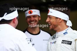 (L to R): Eric Boullier (FRA) McLaren Racing Director with Mike Collier (GBR) Personal Trainer and Jenson Button (GBR) McLaren  09.10.2015. Formula 1 World Championship, Rd 15, Russian Grand Prix, Sochi Autodrom, Sochi, Russia, Practice Day.