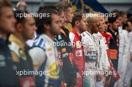 Lewis Hamilton (GBR) Mercedes AMG F1 as the grid observes the national anthem. 11.10.2015. Formula 1 World Championship, Rd 15, Russian Grand Prix, Sochi Autodrom, Sochi, Russia, Race Day.