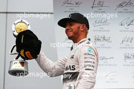 Race winner Lewis Hamilton (GBR) Mercedes AMG F1 celebrates on the podium. 11.10.2015. Formula 1 World Championship, Rd 15, Russian Grand Prix, Sochi Autodrom, Sochi, Russia, Race Day.