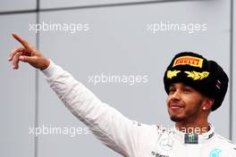 Race winner Lewis Hamilton (GBR) Mercedes AMG F1 celebrates on the podium. 11.10.2015. Formula 1 World Championship, Rd 15, Russian Grand Prix, Sochi Autodrom, Sochi, Russia, Race Day.