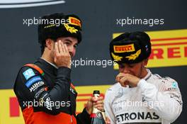 (L to R): Sergio Perez (MEX) Sahara Force India F1 celebrates his third position on the podium with race winner Lewis Hamilton (GBR) Mercedes AMG F1. 11.10.2015. Formula 1 World Championship, Rd 15, Russian Grand Prix, Sochi Autodrom, Sochi, Russia, Race Day.