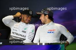 (L to R): Lewis Hamilton (GBR) Mercedes AMG F1 and Sergio Perez (MEX) Sahara Force India F1 in the FIA Press Conference. 11.10.2015. Formula 1 World Championship, Rd 15, Russian Grand Prix, Sochi Autodrom, Sochi, Russia, Race Day.