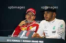 Lewis Hamilton (GBR) Mercedes AMG F1 and Sebastian Vettel (GER) Ferrari in the FIA Press Conference. 11.10.2015. Formula 1 World Championship, Rd 15, Russian Grand Prix, Sochi Autodrom, Sochi, Russia, Race Day.