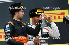 (L to R): Sergio Perez (MEX) Sahara Force India F1 celebrates his third position on the podium with race winner Lewis Hamilton (GBR) Mercedes AMG F1. 11.10.2015. Formula 1 World Championship, Rd 15, Russian Grand Prix, Sochi Autodrom, Sochi, Russia, Race Day.