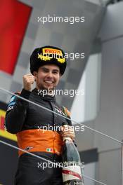 Sergio Perez (MEX) Sahara Force India F1 celebrates his third position on the podium. 11.10.2015. Formula 1 World Championship, Rd 15, Russian Grand Prix, Sochi Autodrom, Sochi, Russia, Race Day.