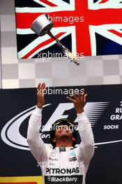 Race winner Lewis Hamilton (GBR) Mercedes AMG F1 celebrates on the podium. 11.10.2015. Formula 1 World Championship, Rd 15, Russian Grand Prix, Sochi Autodrom, Sochi, Russia, Race Day.