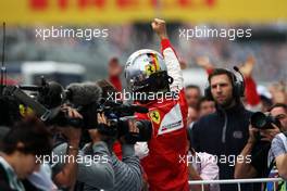 Sebastian Vettel (GER) Ferrari celebrates his second position in parc ferme. 11.10.2015. Formula 1 World Championship, Rd 15, Russian Grand Prix, Sochi Autodrom, Sochi, Russia, Race Day.