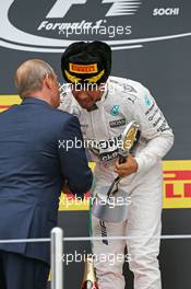 Race winner Lewis Hamilton (GBR) Mercedes AMG F1 celebrates on the podium with Vladimir Putin (RUS) Russian Federation President. 11.10.2015. Formula 1 World Championship, Rd 15, Russian Grand Prix, Sochi Autodrom, Sochi, Russia, Race Day.