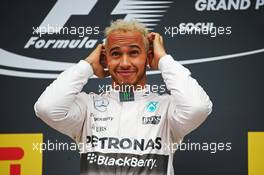 Race winner Lewis Hamilton (GBR) Mercedes AMG F1 celebrates on the podium. 11.10.2015. Formula 1 World Championship, Rd 15, Russian Grand Prix, Sochi Autodrom, Sochi, Russia, Race Day.